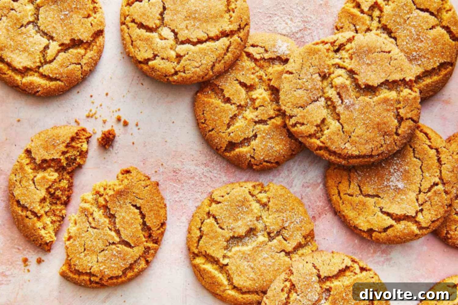 A plate of golden brown ginger snaps, some coated in sugar