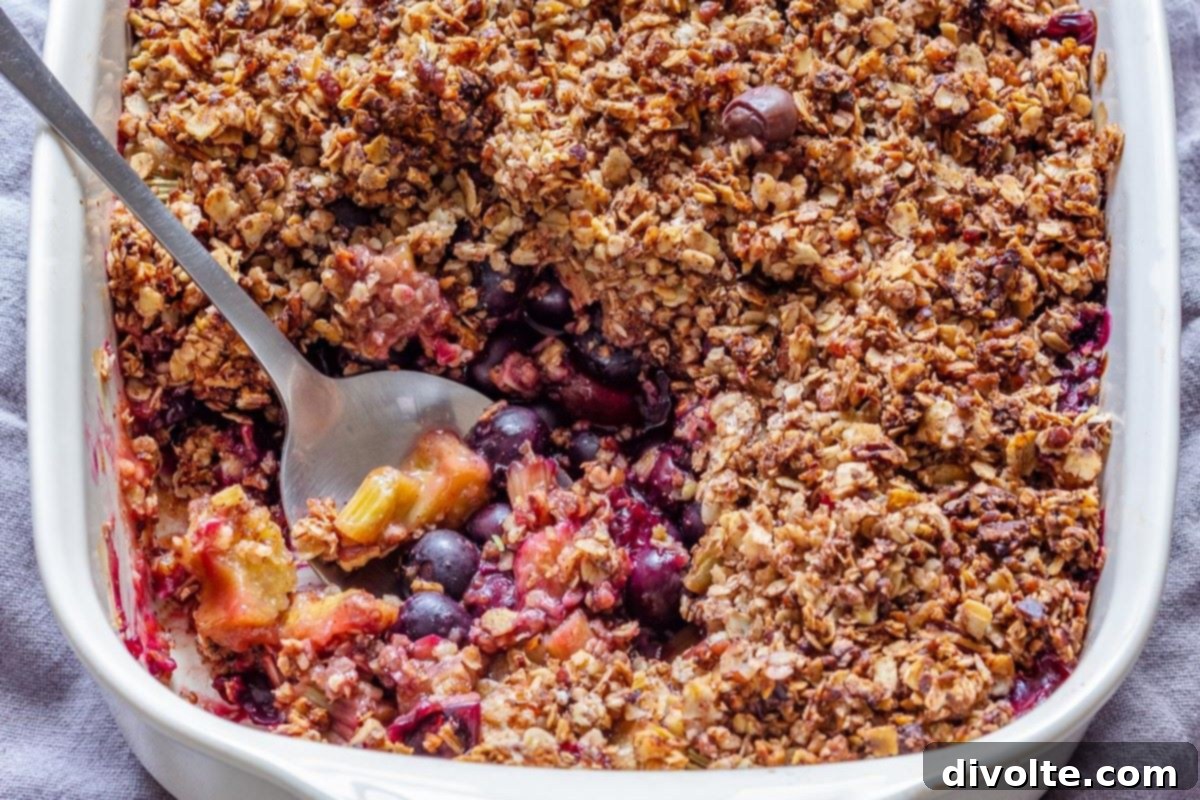 Delicious Blueberry Rhubarb Crisp dessert with a golden, crumbly topping