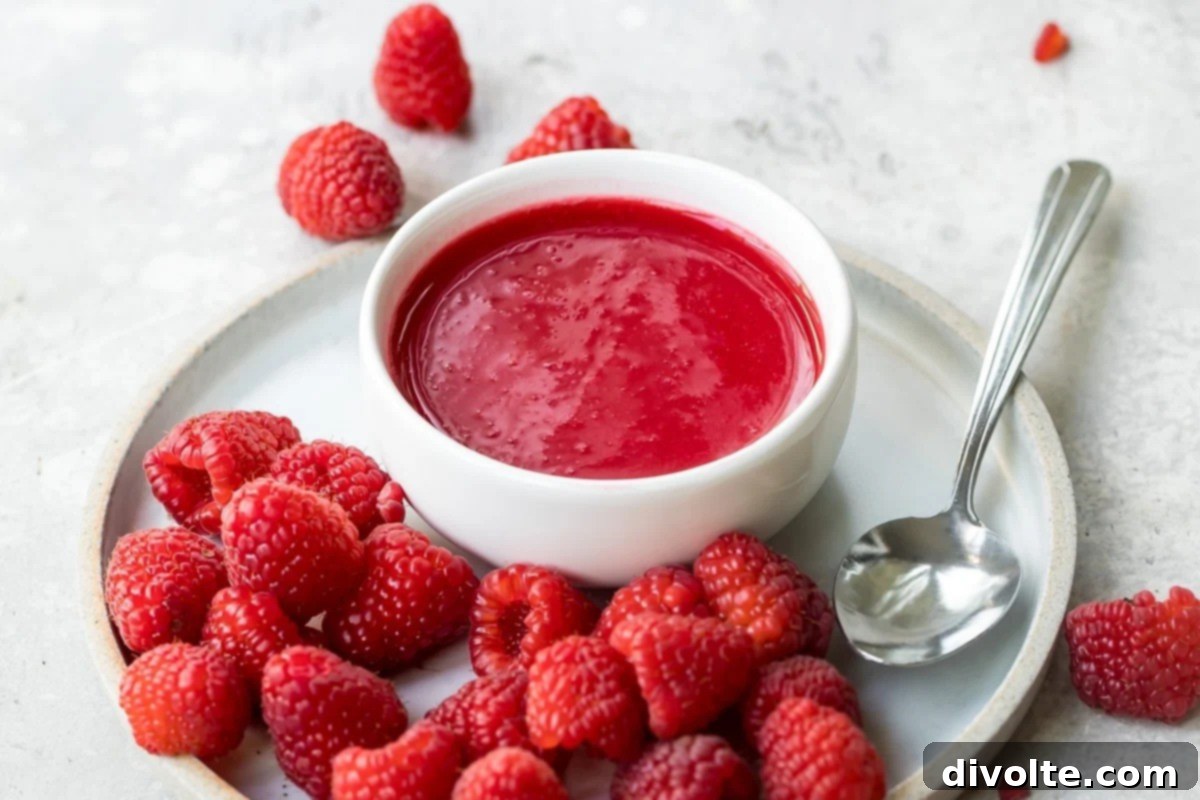 Vibrant homemade Raspberry Coulis, perfect for drizzling over desserts.