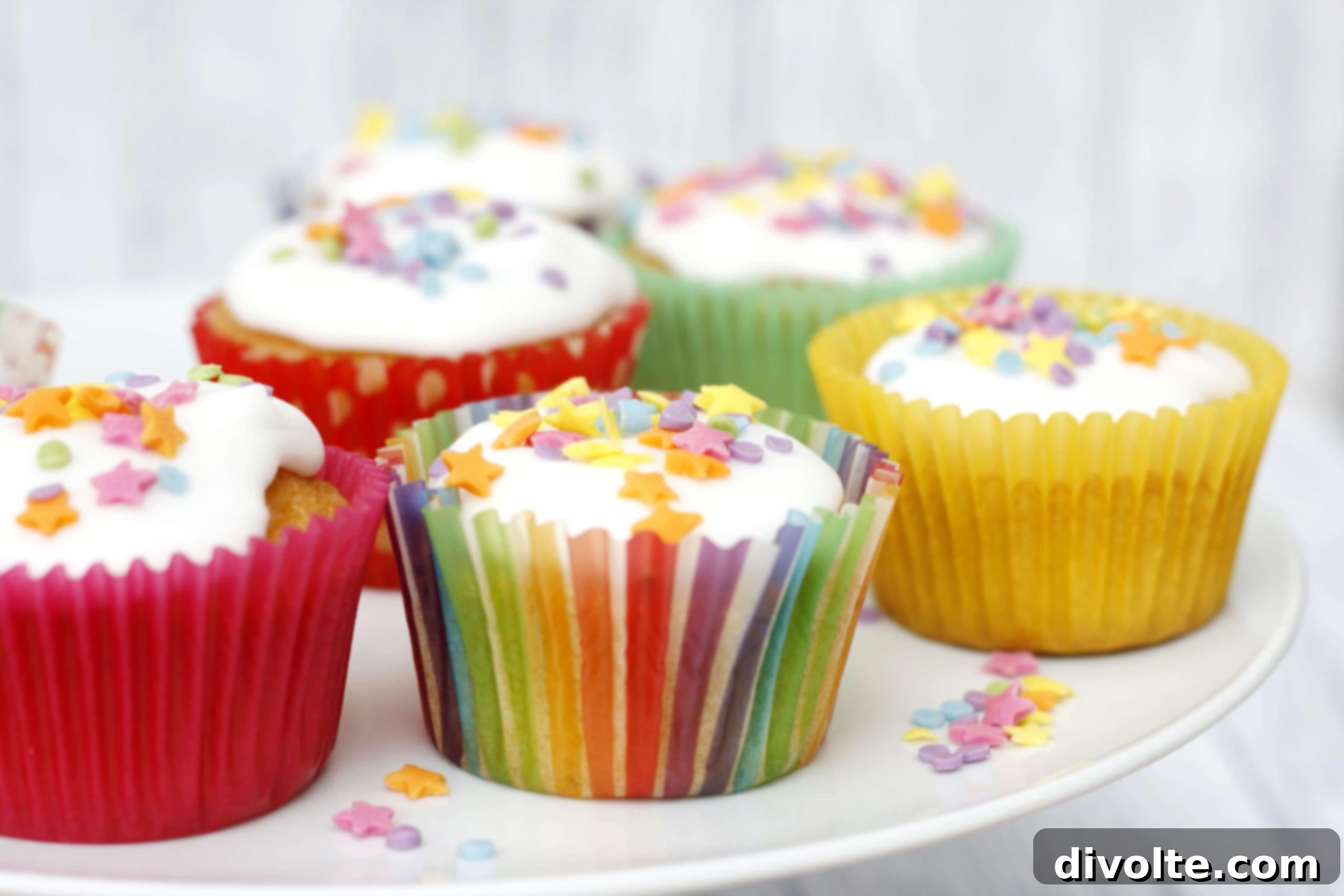 Delicate fairy cakes ready to be served, perhaps with a light dusting of icing sugar.