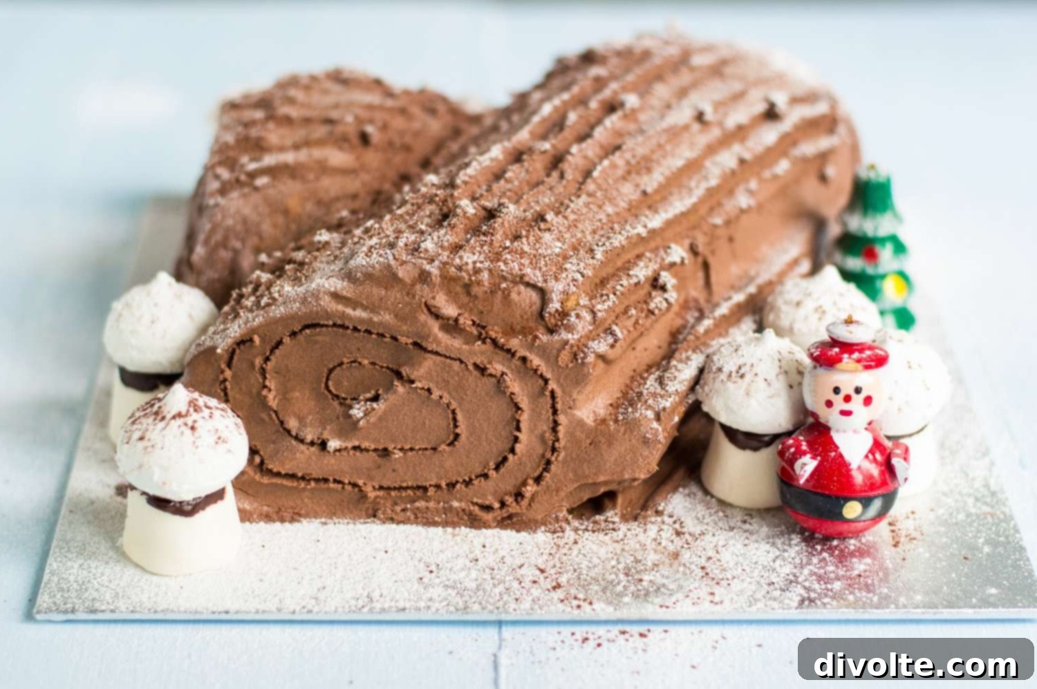Beautifully decorated chocolate Buche de Noel, a classic Yule Log cake