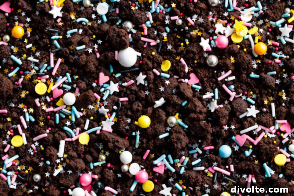 Freshly baked chocolate cookie mixture cooling on a baking sheet, ready for crumbling.