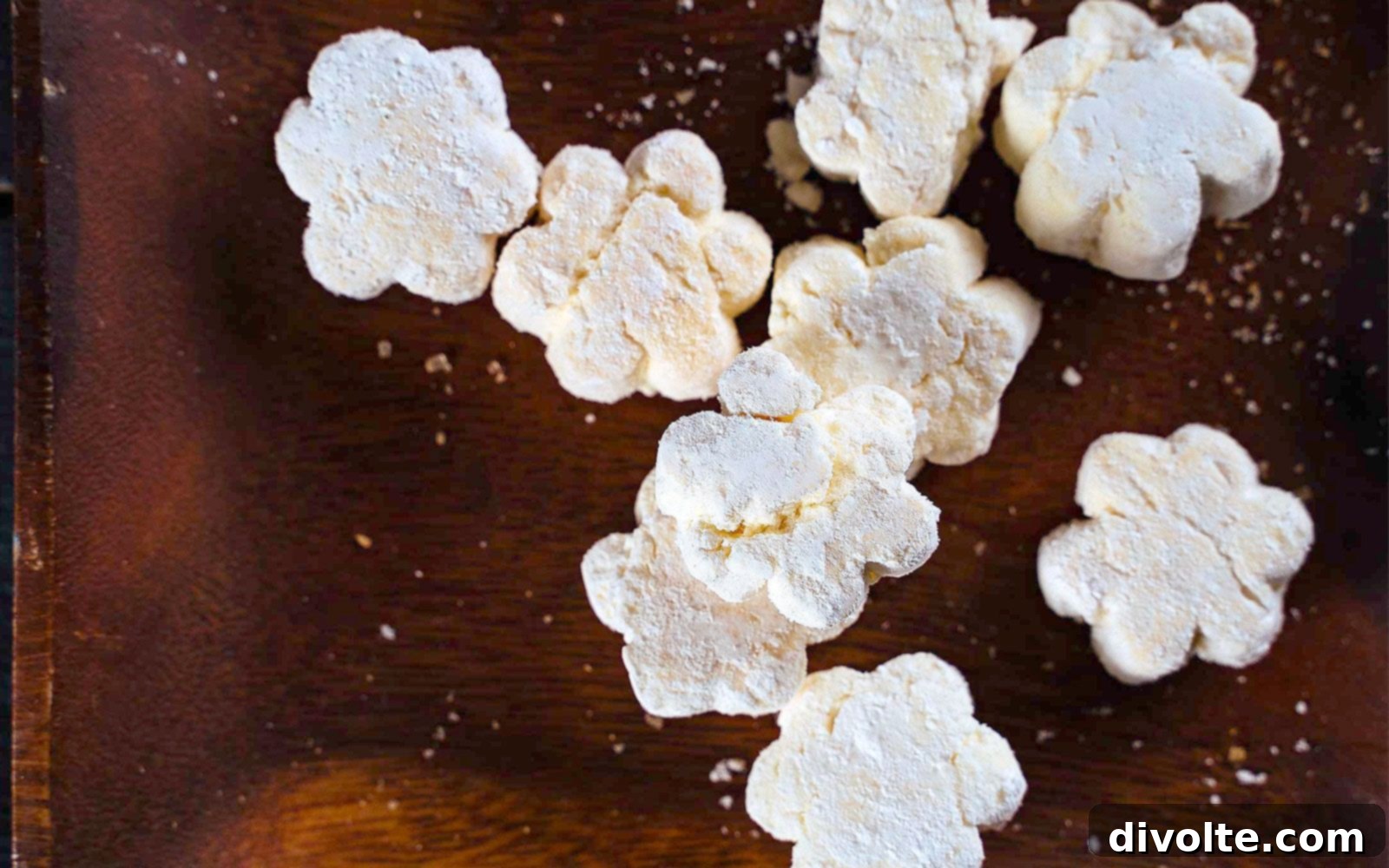 Delicious Puto Seco cookies arranged on a white plate with a cup of coffee, highlighting their light and crumbly texture, perfect for a snack or dessert.