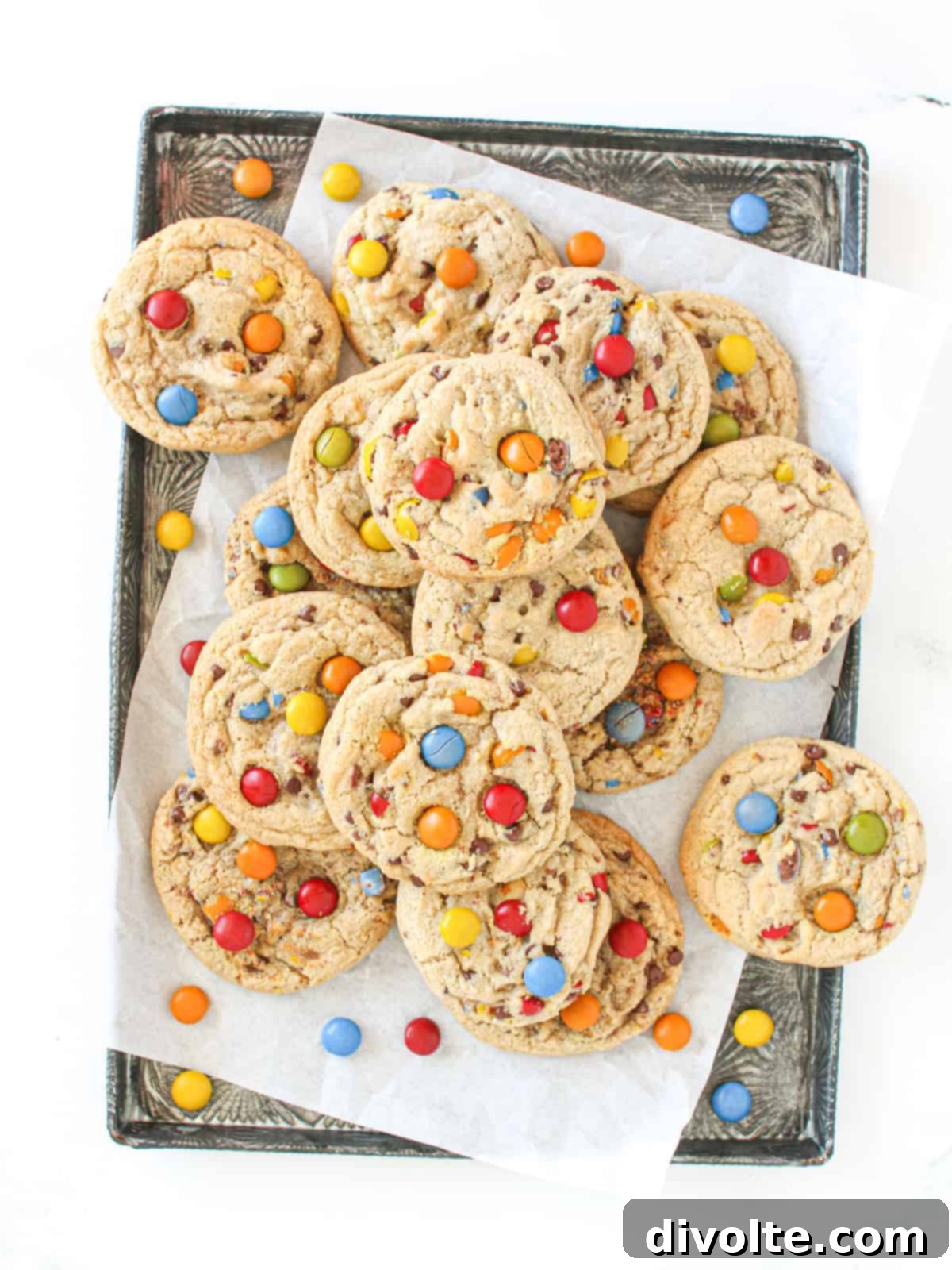 mm-cookies-recipe - Freshly baked M&M cookies cooling on a rack.