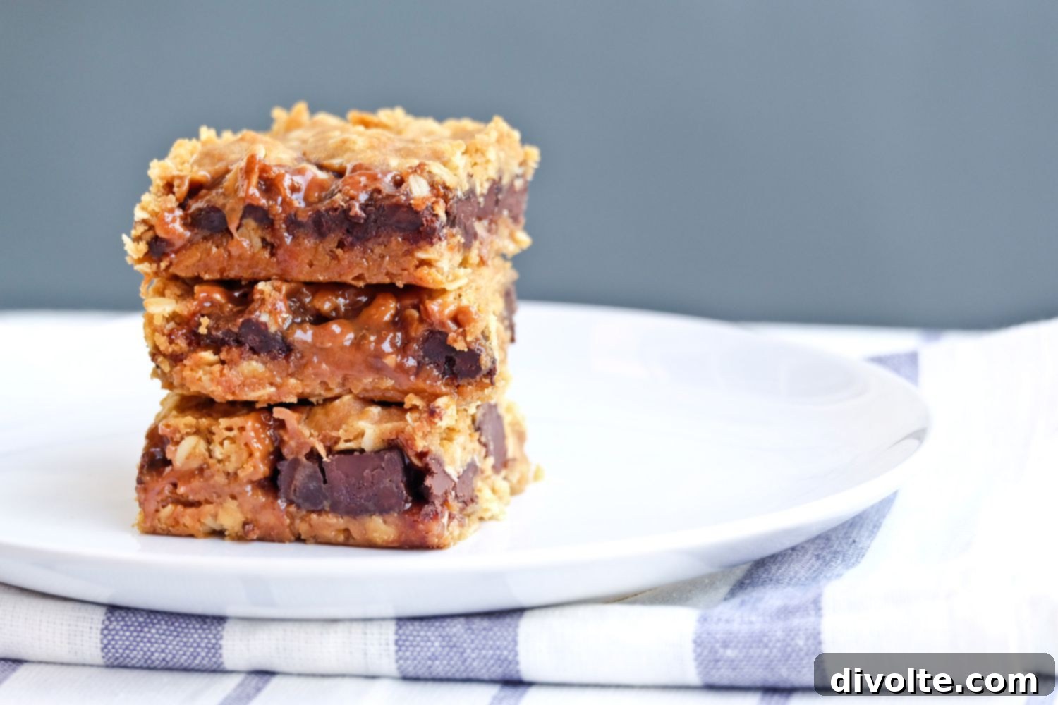 Delicious Oatmeal Carmelitas with gooey caramel and melted chocolate chips, ready to be served
