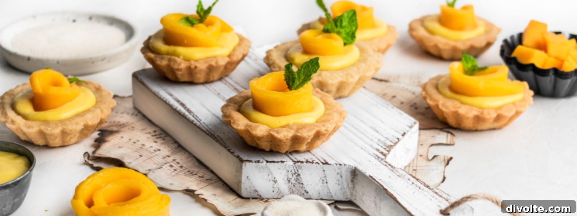 Delicious Mango Tart Recipe 2 A beautifully presented mango tart with a golden crust and vibrant yellow mango filling, garnished with fresh mango slices.