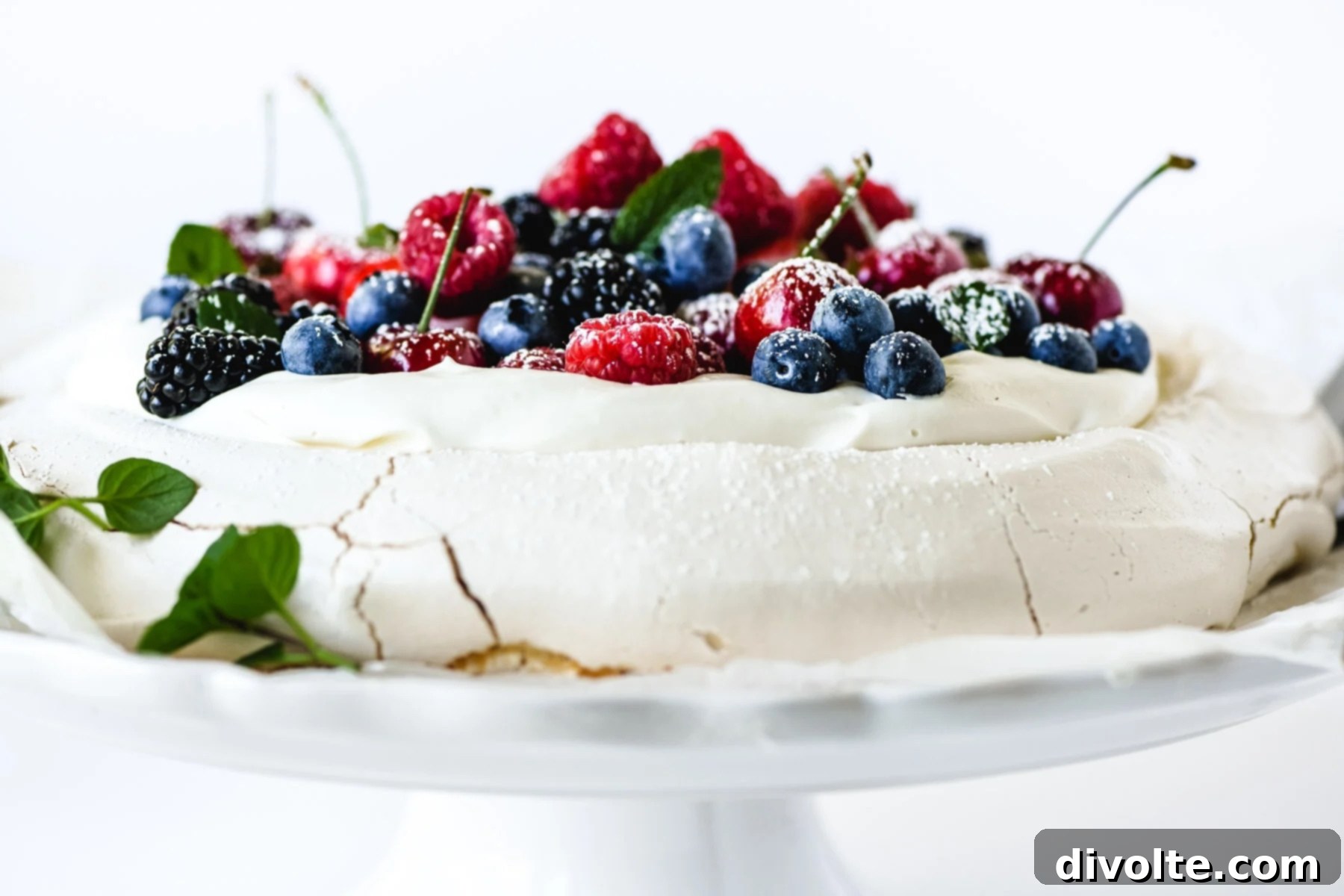Berry Pavlova Recipe: A delightful dessert with crisp meringue, whipped cream, and fresh berries