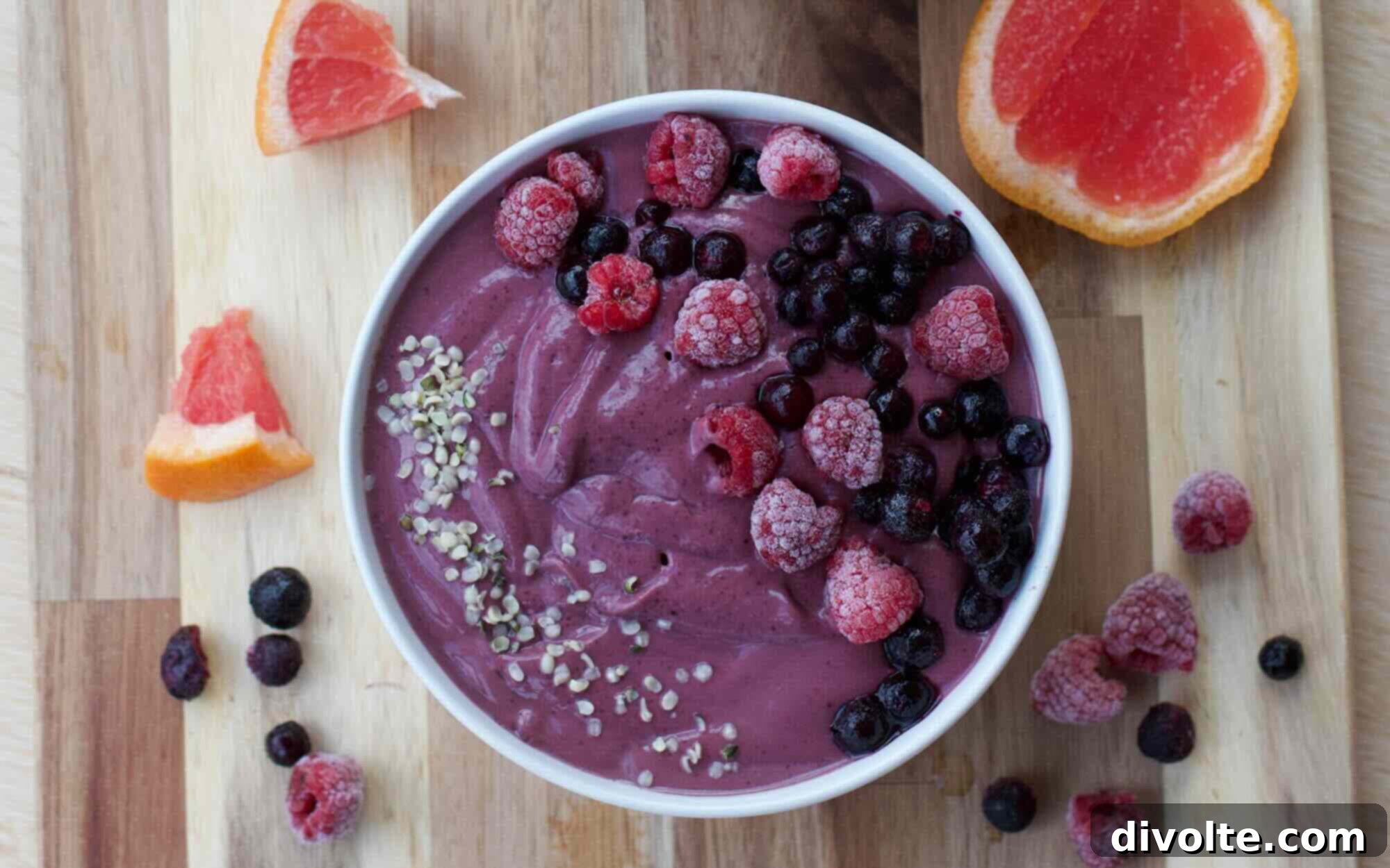 Effortless Berry Smoothie Bowl 3 Fresh Berry Smoothie Bowl topped with granola and coconut flakes