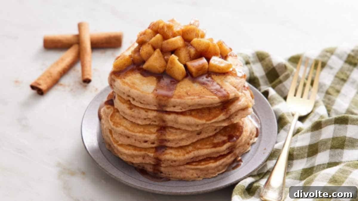 Freshly Made Apple Pancakes Stacked and Drizzled with Syrup