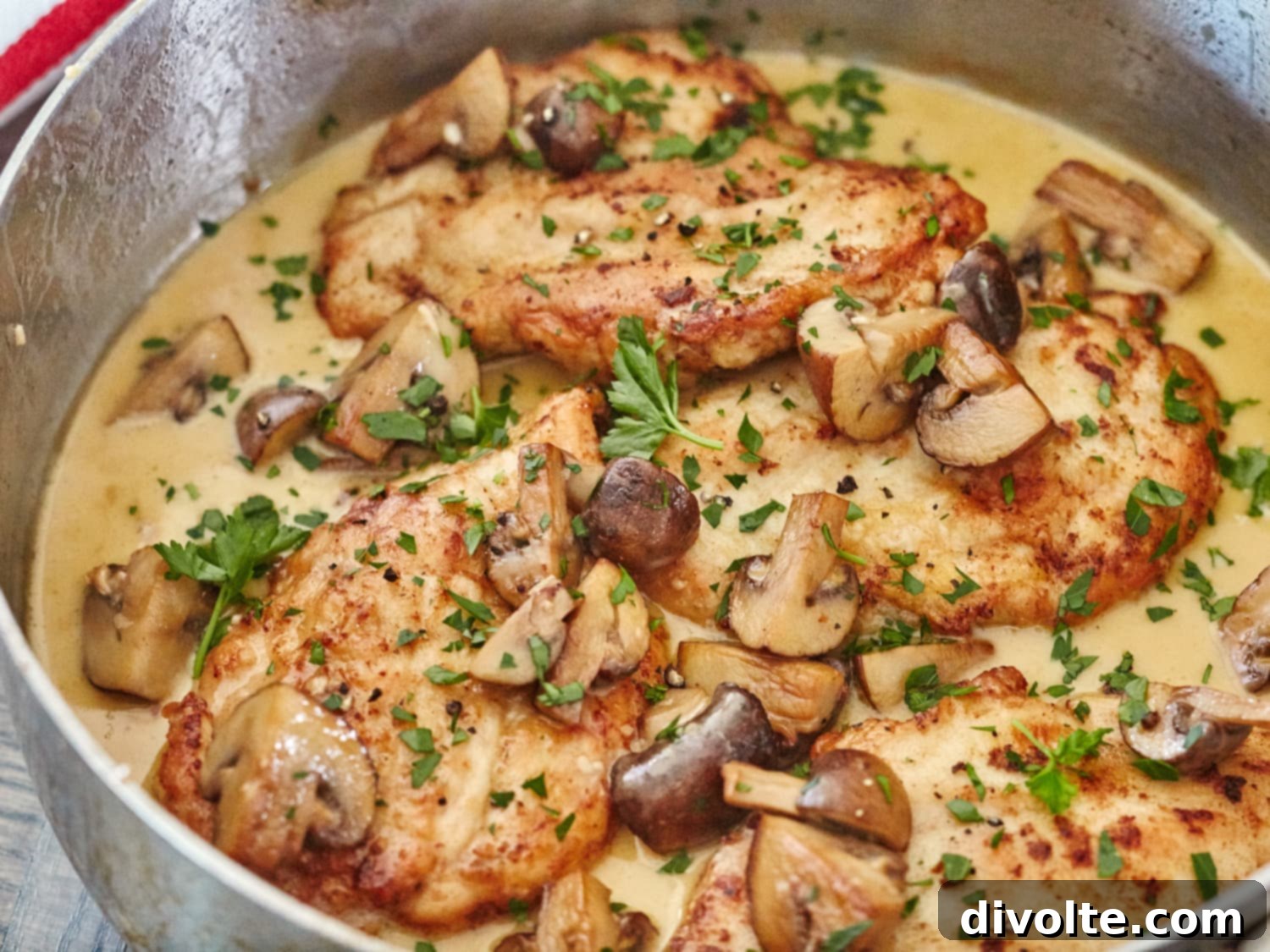 Delicious homemade Chicken Marsala recipe served with fresh parsley garnish