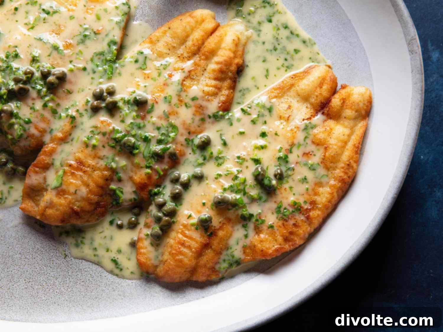 Delicious baked white fish with lemon and garlic slices