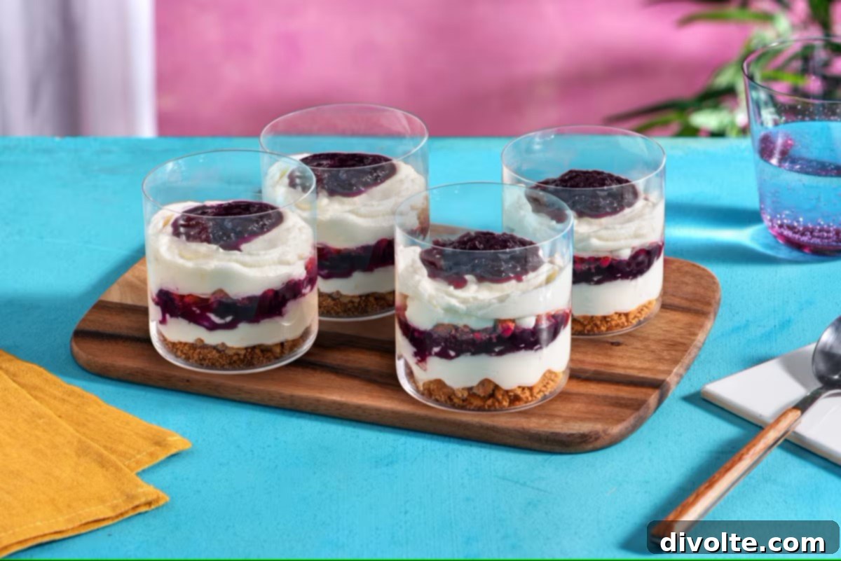 blueberry-cheesecake-parfait-recipe - layered dessert with graham cracker, cream cheese, and blueberries