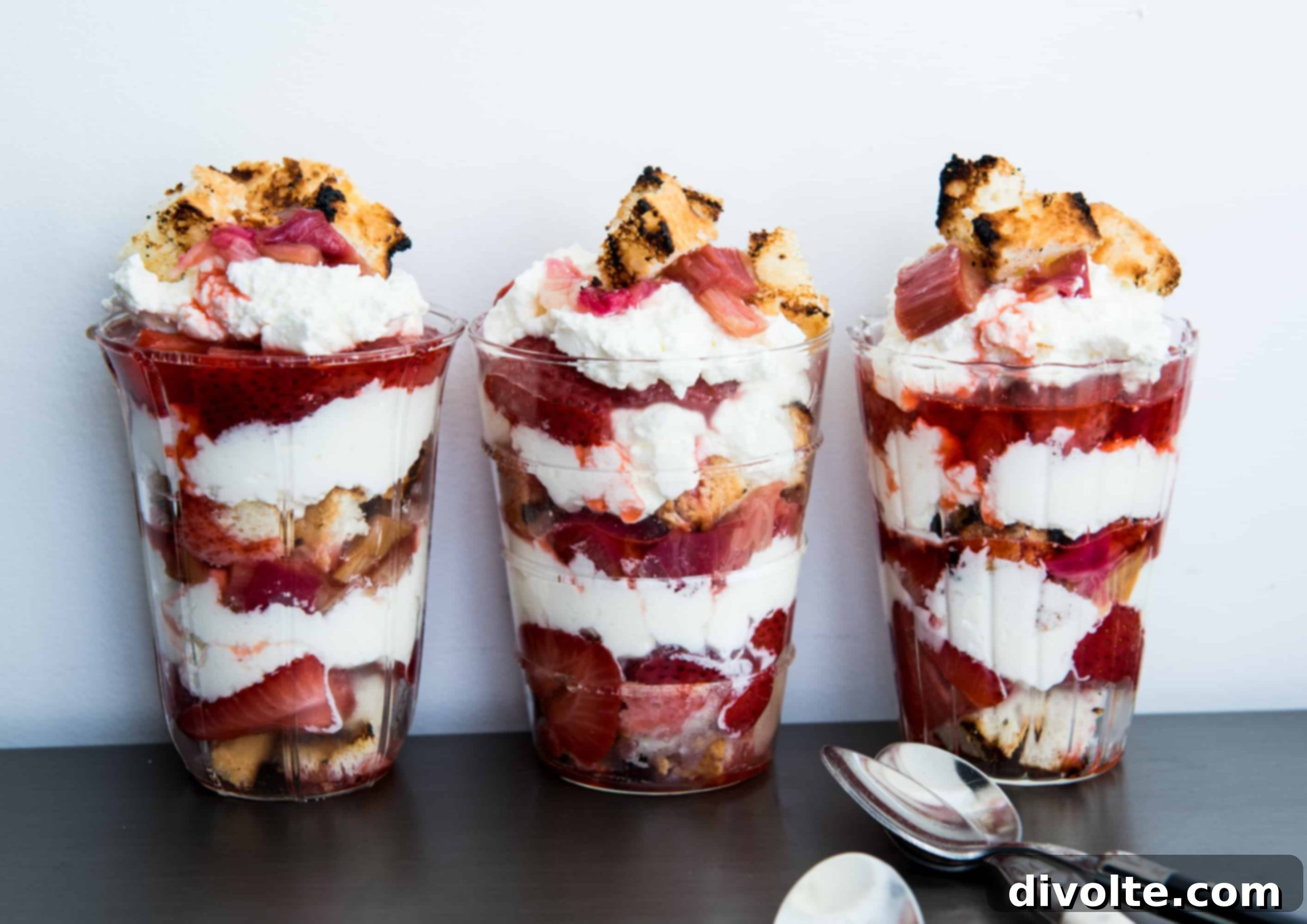 Delicious and healthy layered berry parfait recipe, perfect for breakfast or dessert with Greek yogurt and granola