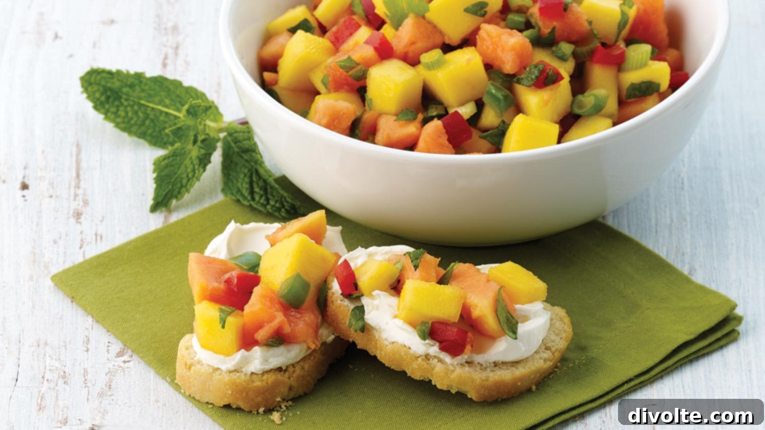 mango-salsa-bruschetta-recipe - A vibrant appetizer featuring fresh mango salsa on toasted baguette slices.