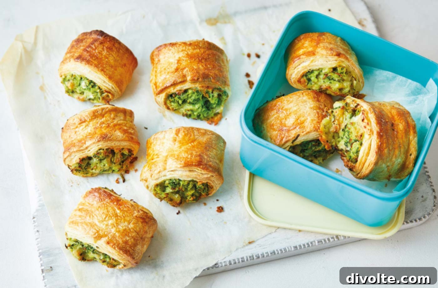 Delicious and vibrant homemade veggie spring rolls, perfectly rolled and ready to serve, showcasing the fresh carrot, cabbage, and bell pepper filling.