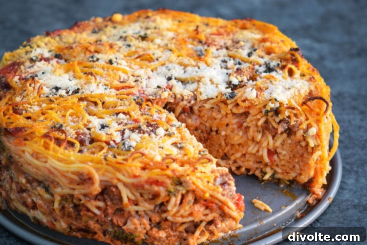 Delicious homemade spaghetti pie with cheese and marinara sauce, perfect for dinner