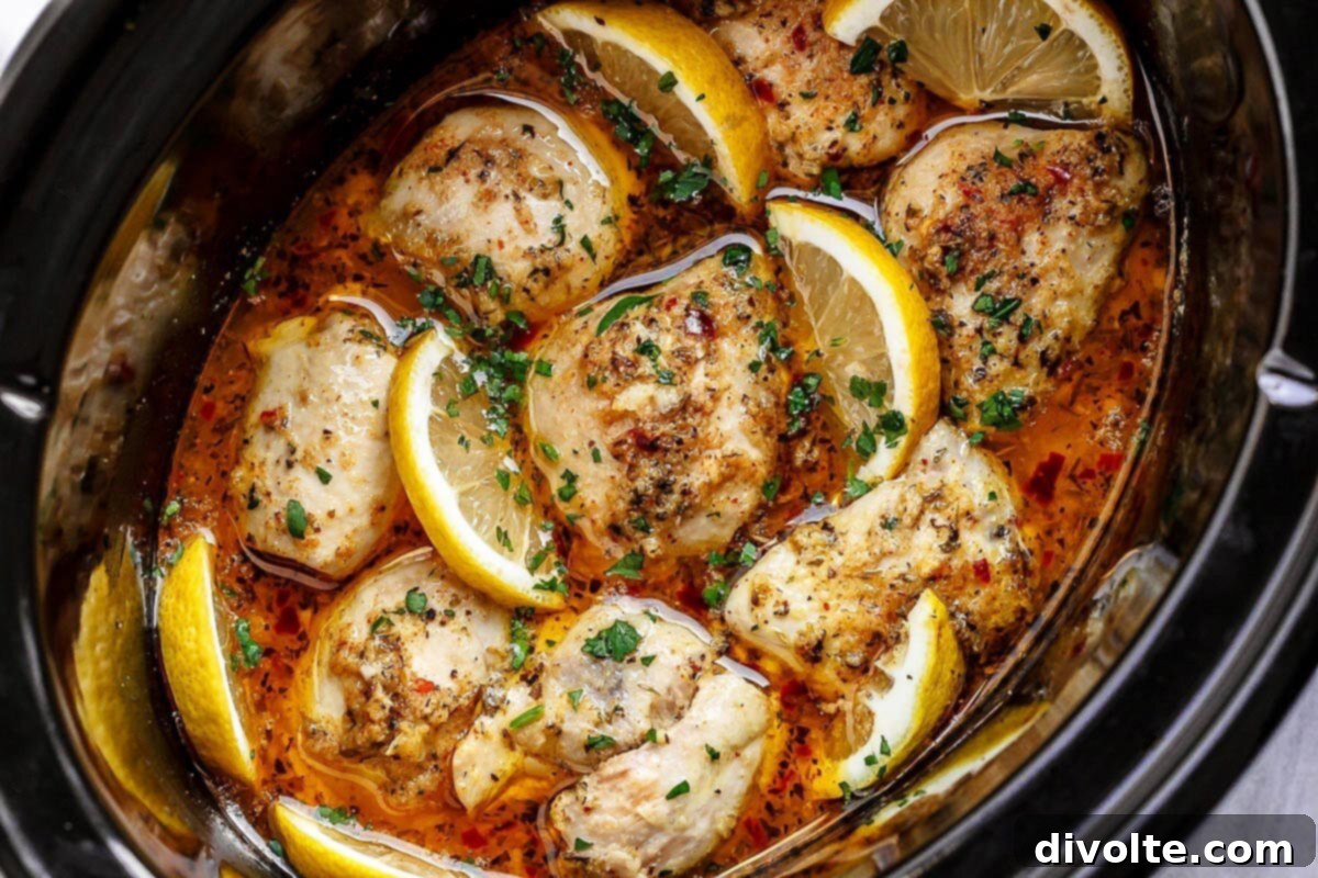 slow-cooker-lemon-garlic-chicken-recipe - tender, juicy chicken in a zesty sauce