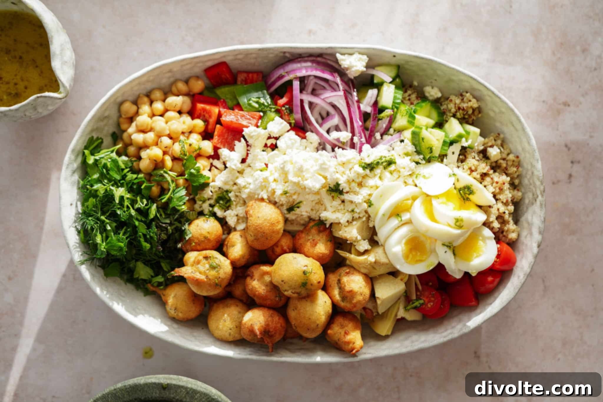 Vibrant Mediterranean Quinoa 2 Delicious and healthy Mediterranean quinoa salad with fresh vegetables, crumbled feta cheese, and a zesty lemon dressing