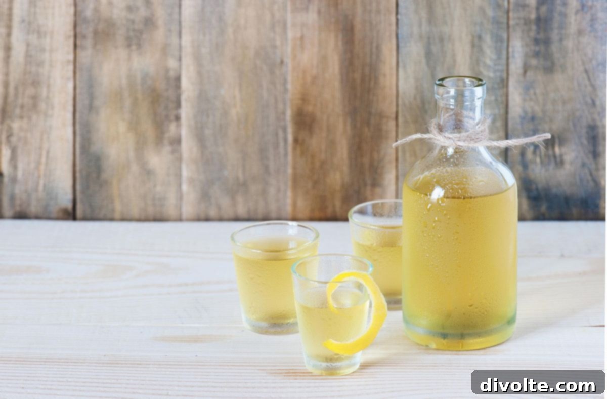 Crafting Homemade Limoncello 2 Homemade limoncello in a bottle with fresh lemons